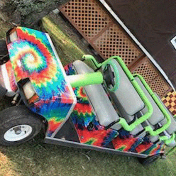 Tie-Dye golf car wrap mounted on a tram